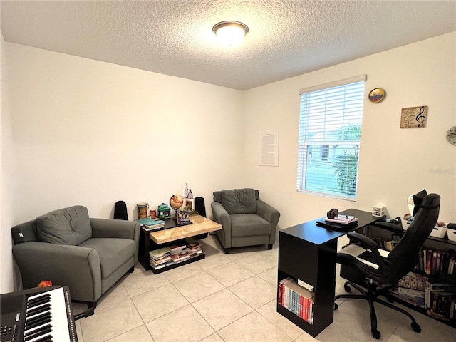 tiled home office featuring a textured ceiling