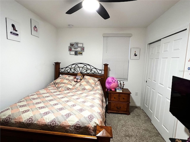 carpeted bedroom featuring a closet and ceiling fan