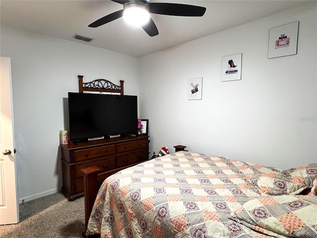 bedroom with ceiling fan and light carpet