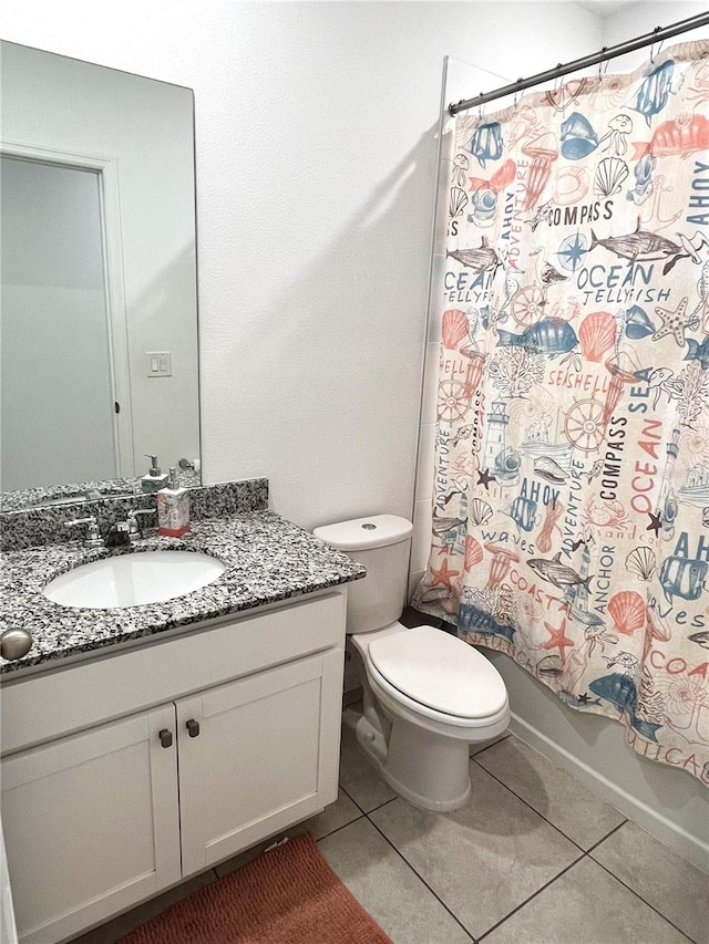 full bathroom featuring tile patterned floors, shower / bath combo with shower curtain, vanity, and toilet