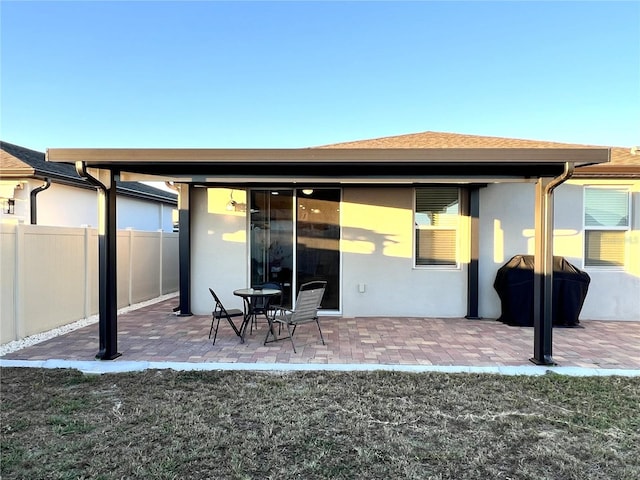 back of house with a patio area