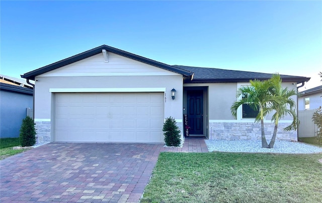 ranch-style home with a garage and a front lawn