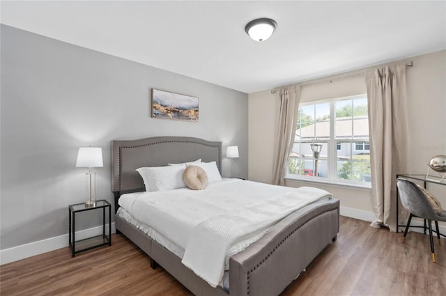 bedroom with hardwood / wood-style floors