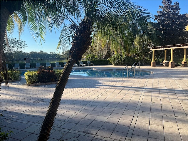 view of swimming pool featuring a patio