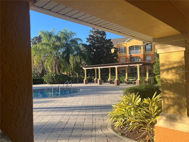 view of pool featuring a pergola and a patio area