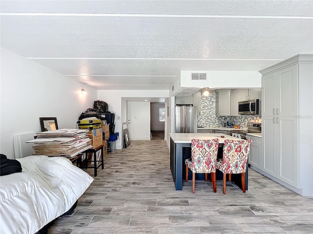 dining space featuring light wood-type flooring