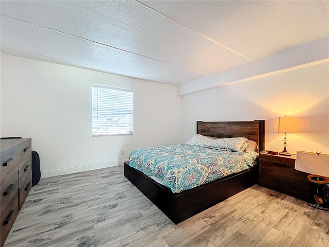 bedroom with light hardwood / wood-style floors