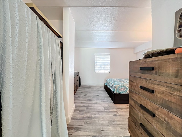 bedroom with light hardwood / wood-style flooring