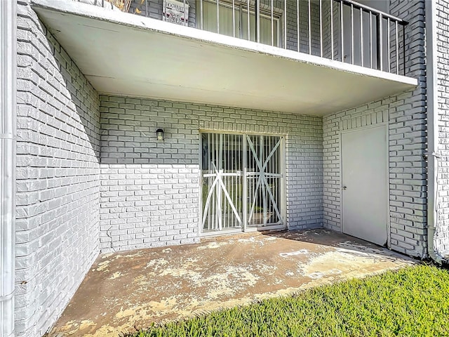 doorway to property with a patio area