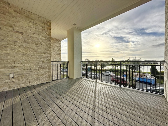 wooden deck with a water view