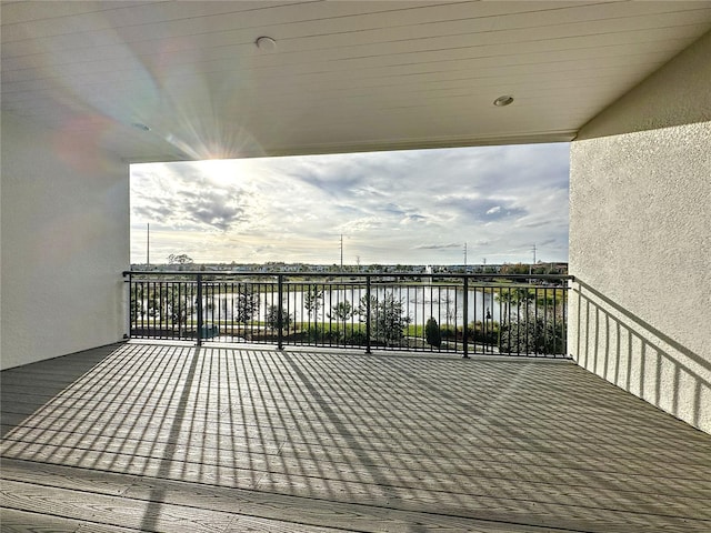 wooden terrace with a water view