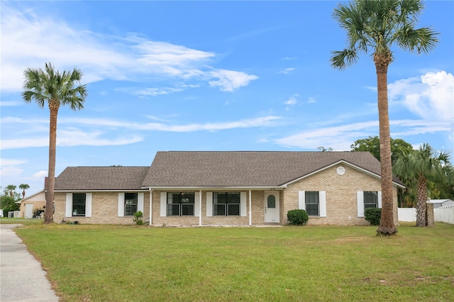 ranch-style house featuring a front yard