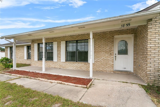 entrance to property with a porch