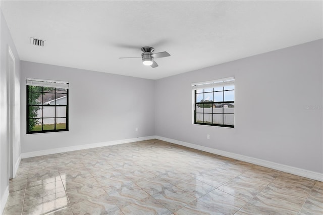 empty room featuring ceiling fan