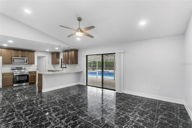 kitchen with lofted ceiling, decorative backsplash, ceiling fan, kitchen peninsula, and stainless steel appliances