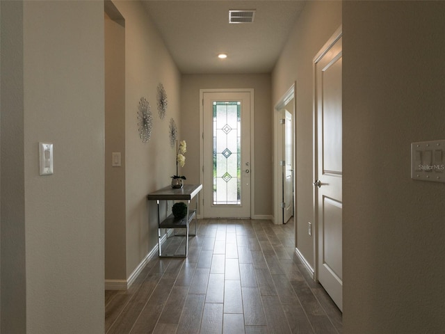 entryway with dark hardwood / wood-style flooring