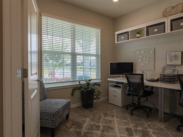 office with dark hardwood / wood-style flooring