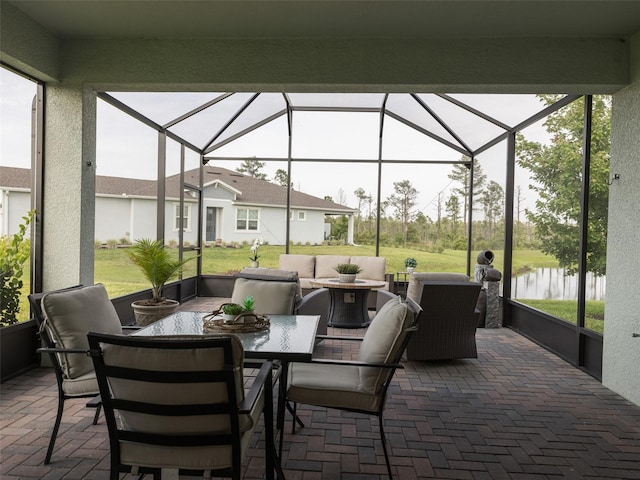 view of patio featuring outdoor lounge area and a lanai