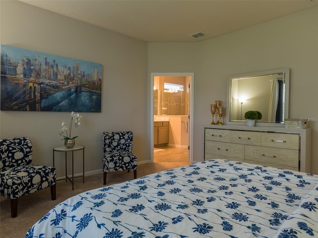 bedroom featuring carpet and ensuite bath