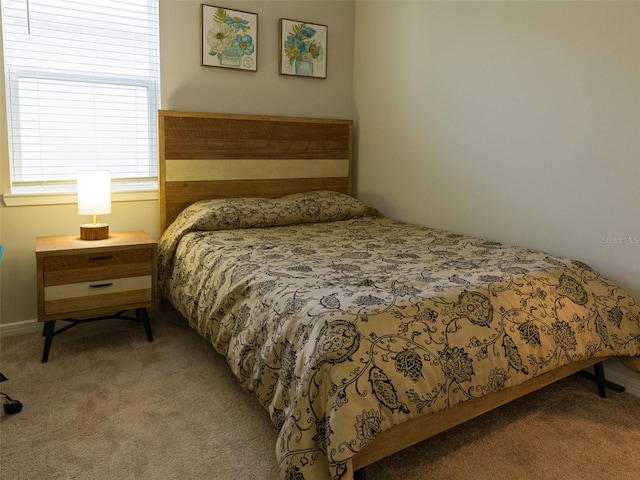 bedroom with light colored carpet