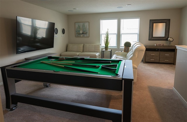 game room featuring light carpet, a textured ceiling, and pool table