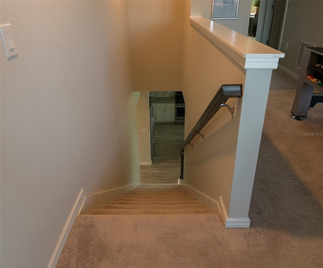 stairway with carpet floors