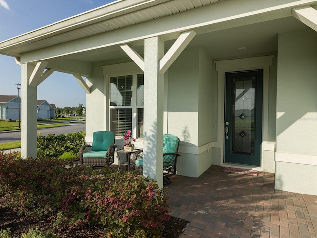 doorway to property with a porch