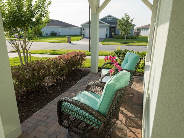 view of patio featuring a garage