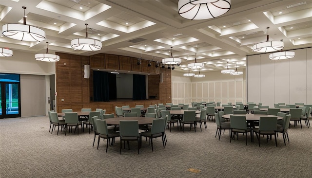 dining area featuring carpet flooring, beamed ceiling, and coffered ceiling