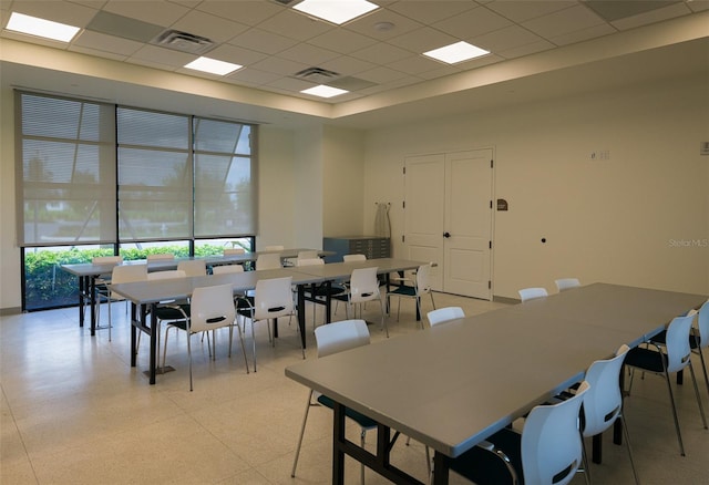 dining space featuring a drop ceiling