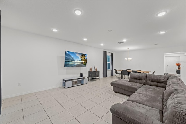 living room with light tile patterned flooring and a chandelier