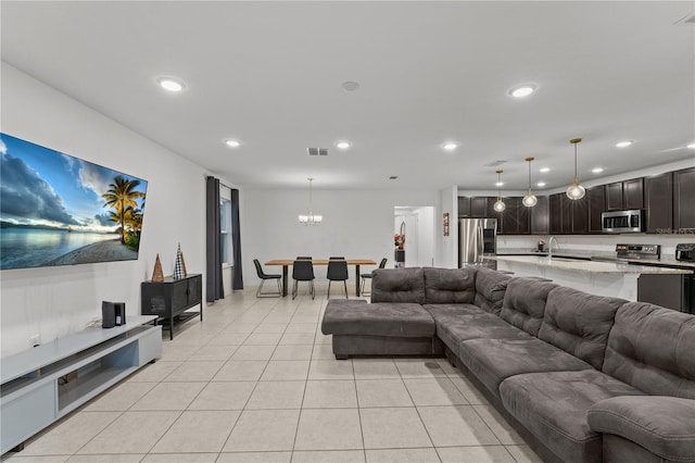 living room with sink and light tile patterned floors