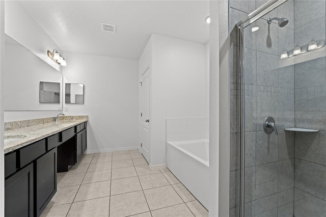 bathroom featuring tile patterned flooring, vanity, and shower with separate bathtub