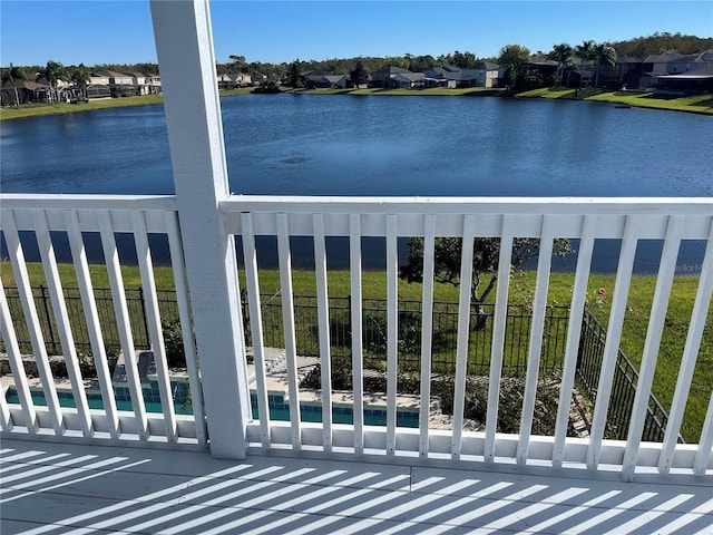 view of water feature with fence and a residential view