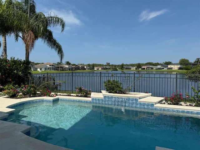 view of pool with a residential view, a fenced in pool, a water view, and fence