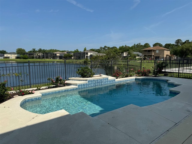 view of swimming pool featuring a fenced in pool, a patio, a fenced backyard, and a water view