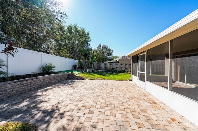 view of patio / terrace with a sunroom