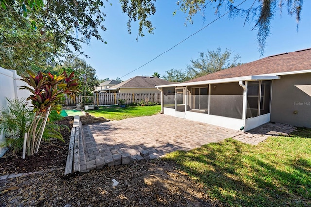 view of yard with a patio and a sunroom