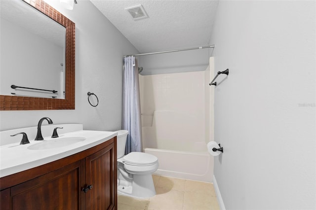 full bathroom featuring tile patterned floors, a textured ceiling, toilet, shower / bath combo with shower curtain, and vanity