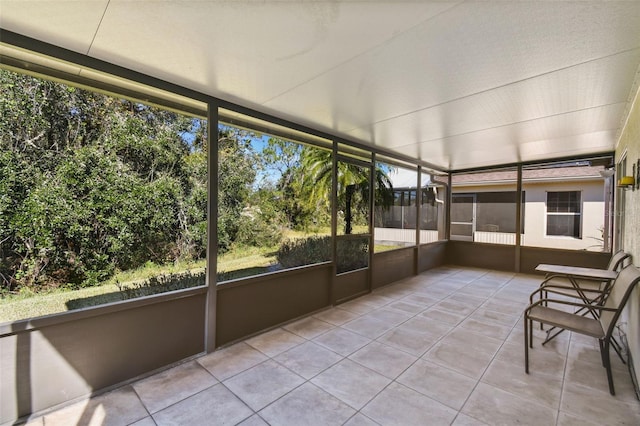 unfurnished sunroom featuring a healthy amount of sunlight