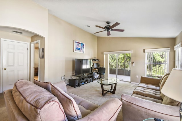 carpeted living room featuring ceiling fan and lofted ceiling