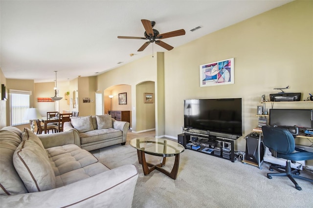 living room with light carpet and ceiling fan