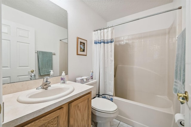 full bathroom featuring vanity, a textured ceiling, shower / bath combo with shower curtain, tile patterned flooring, and toilet