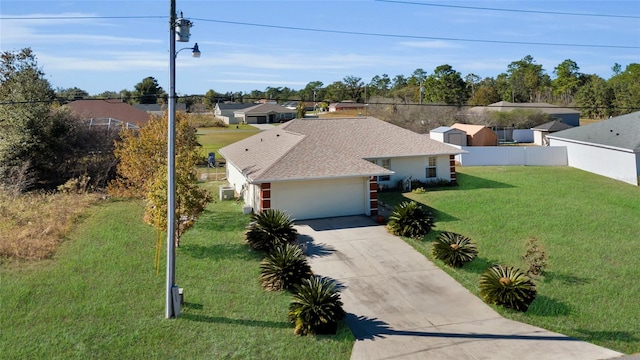 ranch-style home with a front yard and a garage