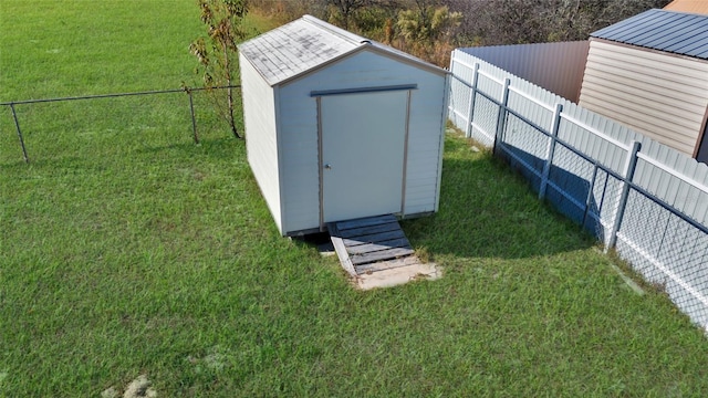 view of outbuilding featuring a yard