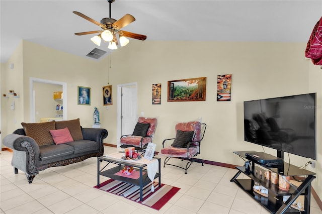 living room featuring ceiling fan, light tile patterned flooring, and vaulted ceiling