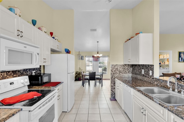 kitchen featuring sink, white cabinets, white appliances, and light tile patterned floors