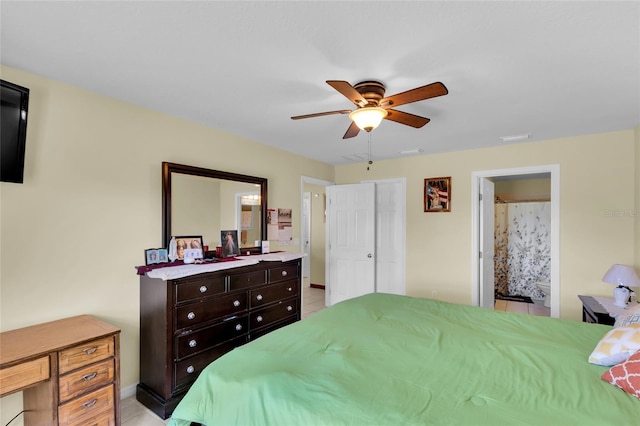 bedroom featuring ensuite bath and ceiling fan