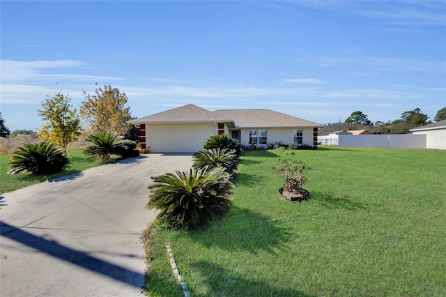 ranch-style home with a front yard and a garage