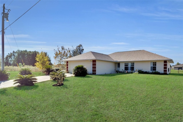 view of front of home with a front lawn